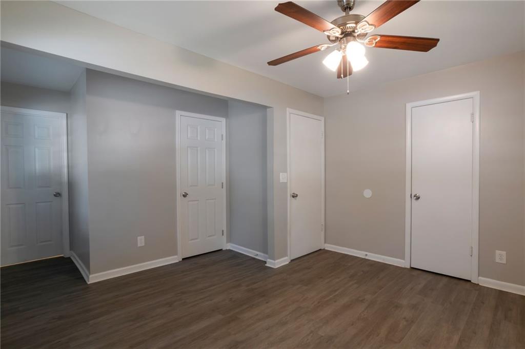 904 Pine Roc Drive Stone Mountain, GA 30083 - Photo 12 of 15 a view of an empty room with wooden floor