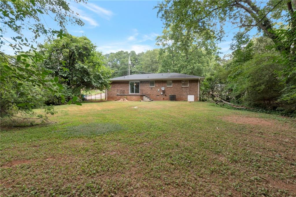 904 Pine Roc Drive Stone Mountain, GA 30083 - Photo 3 of 15 a view of a house with yard and sitting area