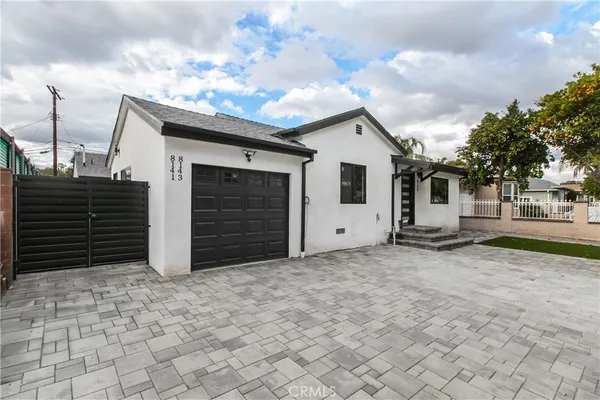 a view of a house with a snow in the yard