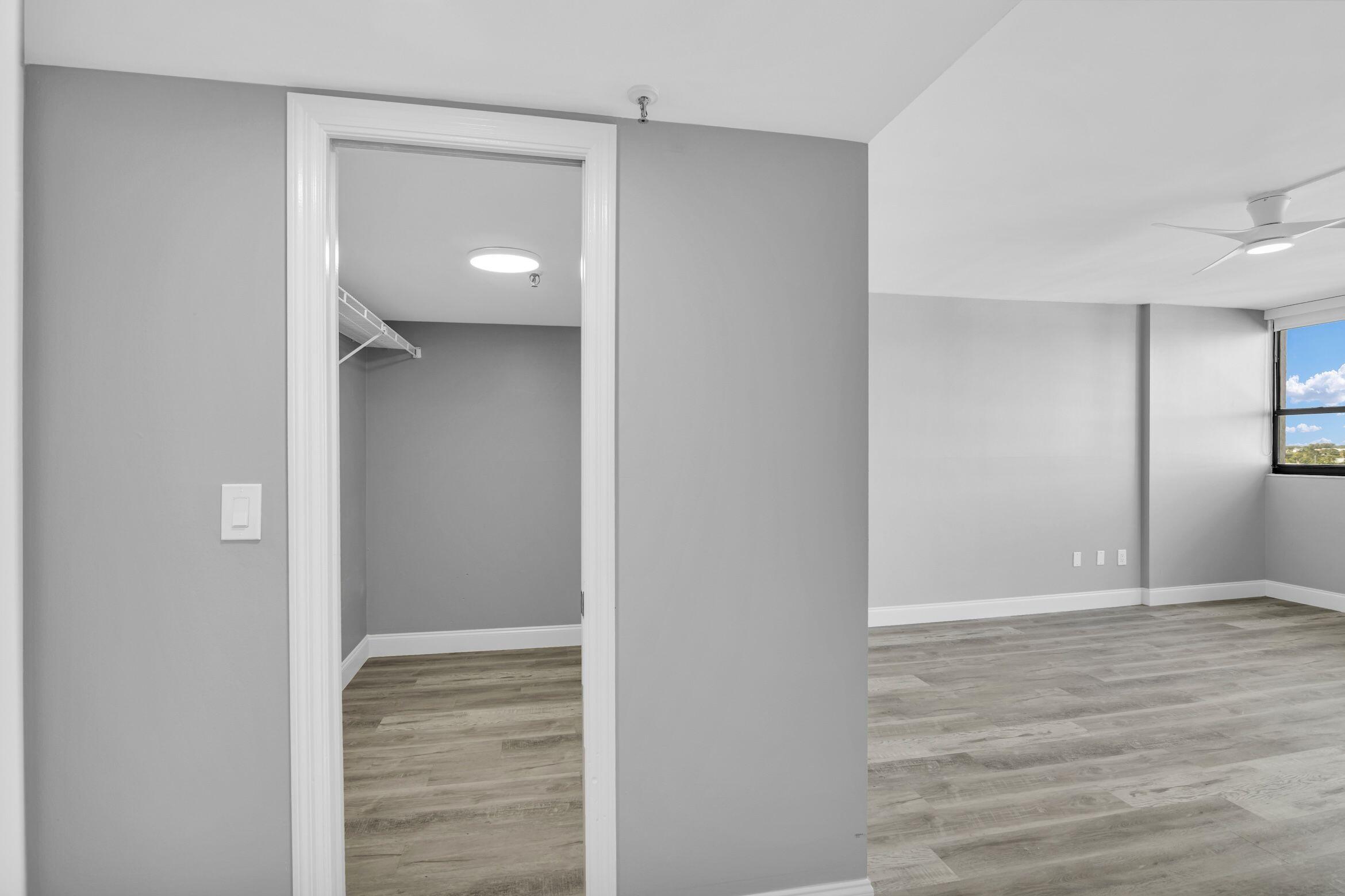 859 Jeffery Street, Unit 810 Boca Raton, FL 33487 - Photo 12 of 61 a view of a hallway with wooden floor