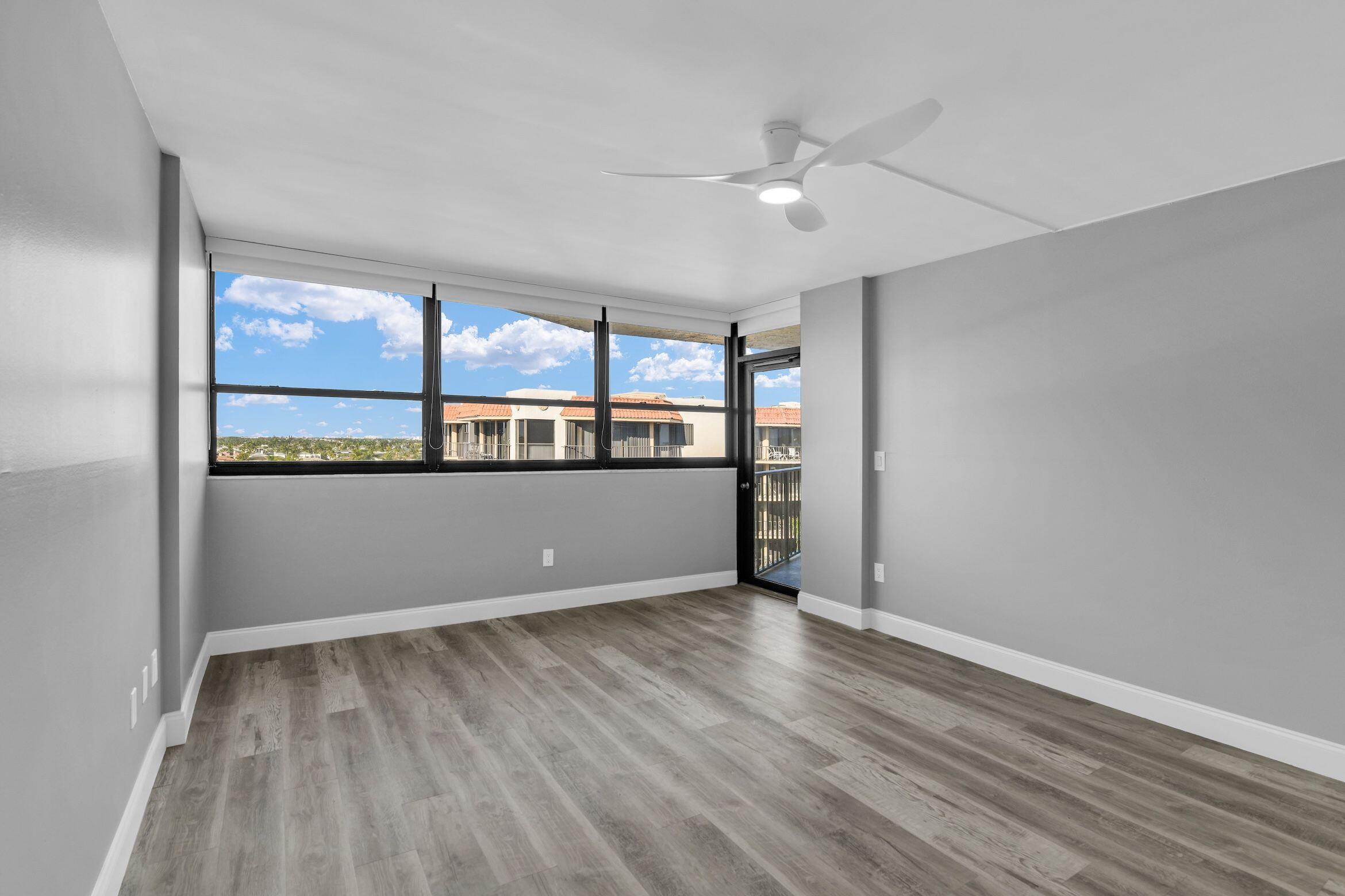 859 Jeffery Street, Unit 810 Boca Raton, FL 33487 - Photo 14 of 61 a view of a room with wooden floor and window