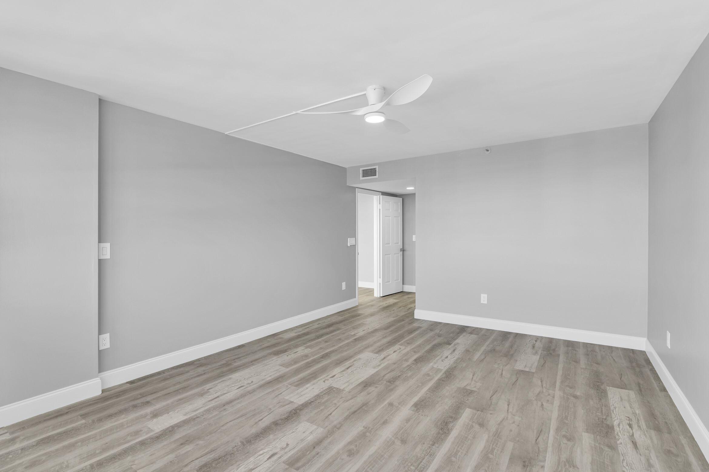 859 Jeffery Street, Unit 810 Boca Raton, FL 33487 - Photo 15 of 61 a view of an empty room with wooden floor