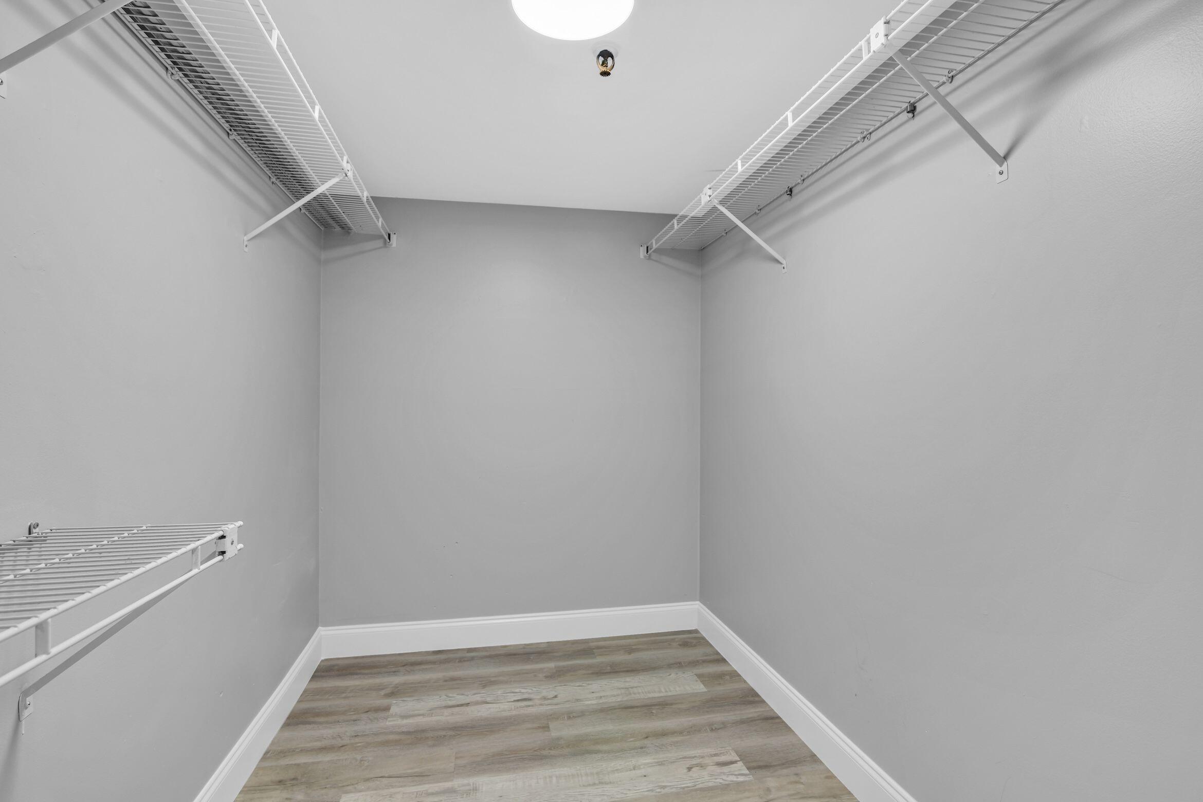 859 Jeffery Street, Unit 810 Boca Raton, FL 33487 - Photo 18 of 61 a view of an empty walk in closet