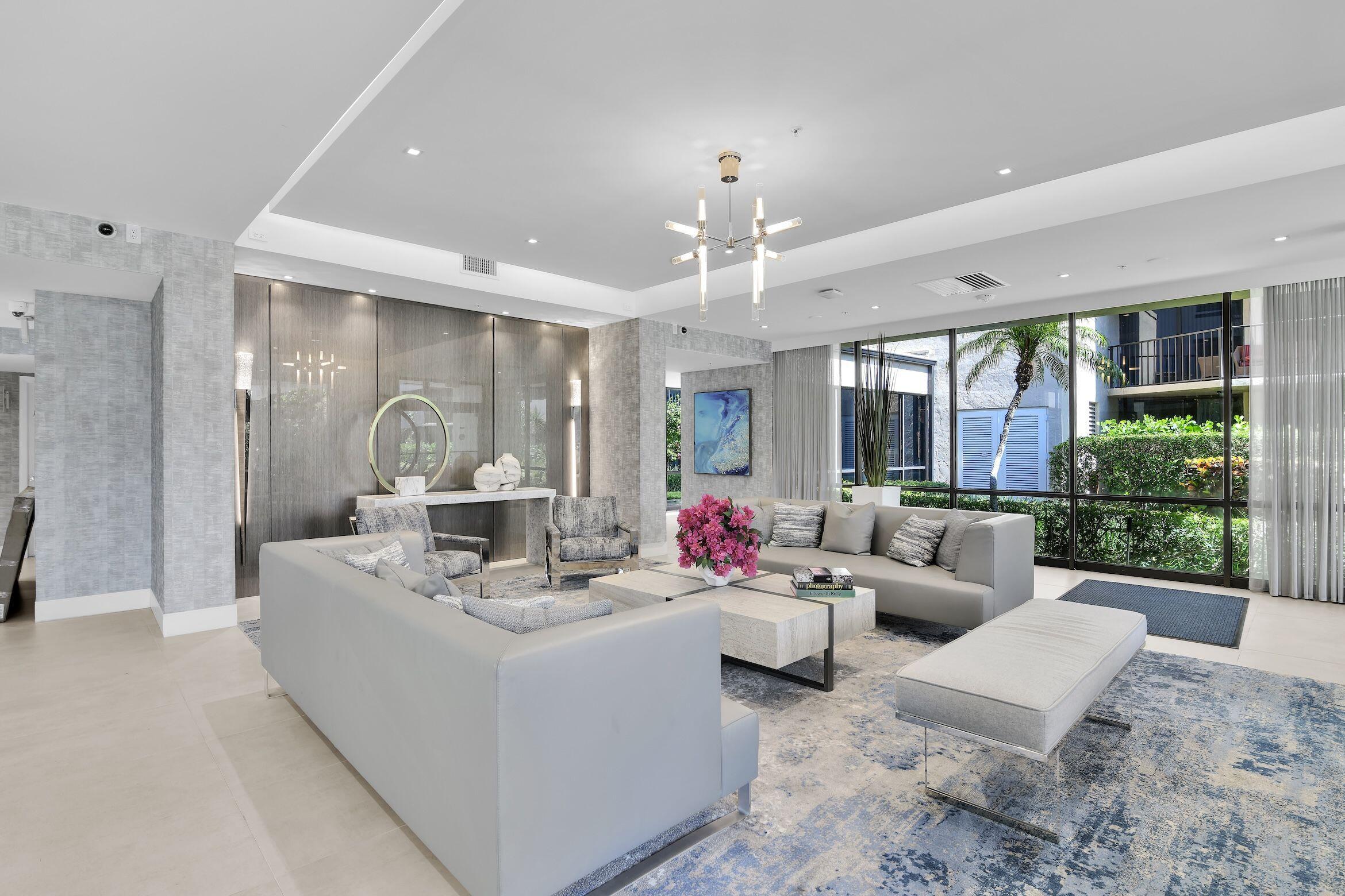 859 Jeffery Street, Unit 810 Boca Raton, FL 33487 - Photo 33 of 61 a living room with furniture and a large window