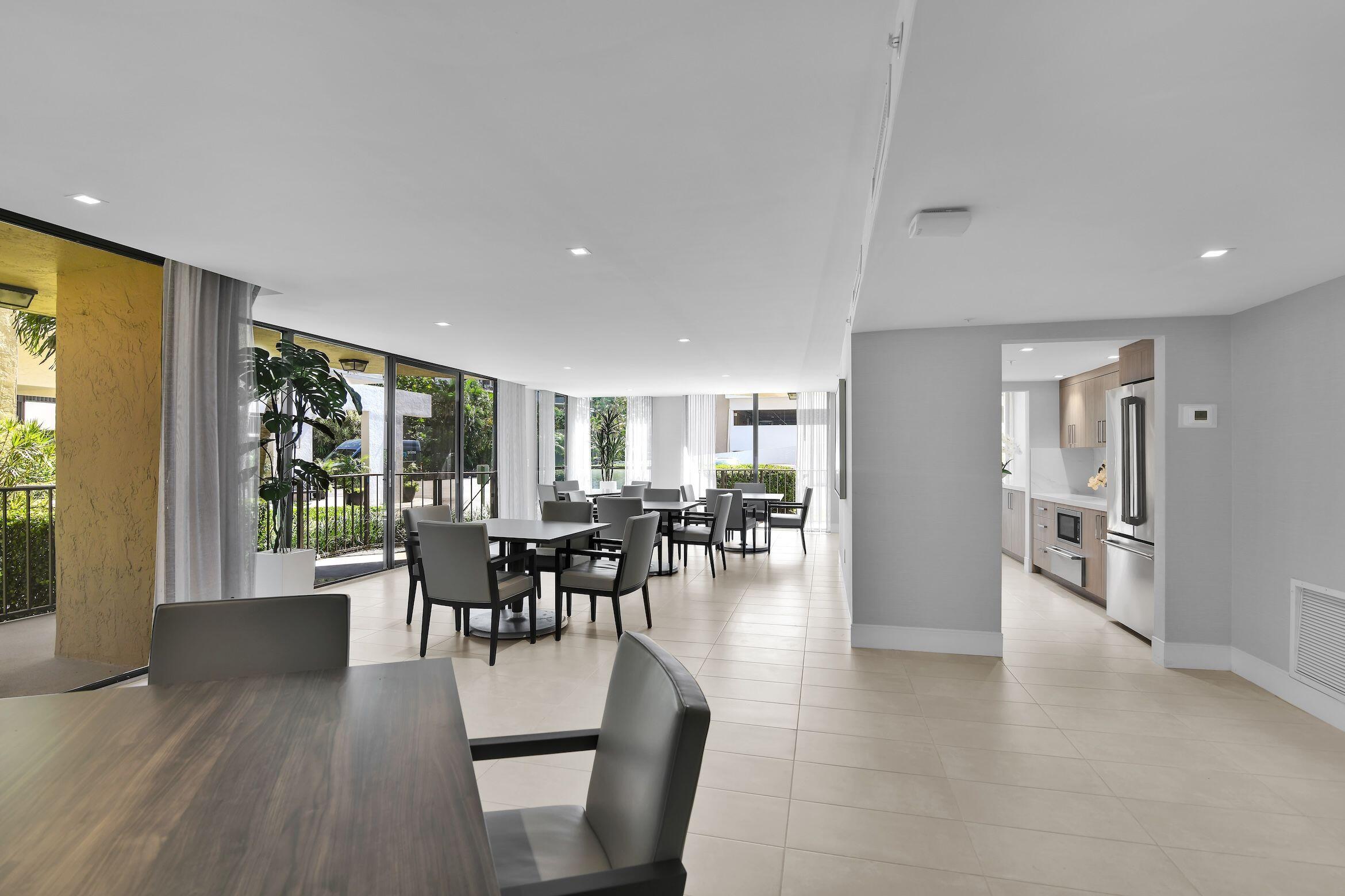 859 Jeffery Street, Unit 810 Boca Raton, FL 33487 - Photo 37 of 61 a view of a dining room with furniture and wooden floor