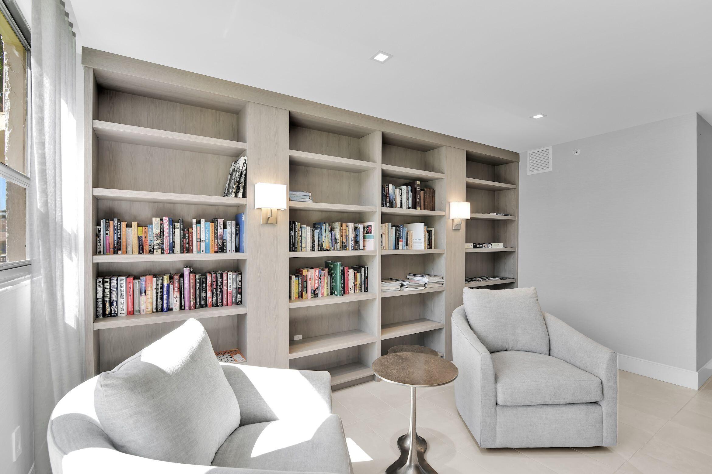 859 Jeffery Street, Unit 810 Boca Raton, FL 33487 - Photo 41 of 61 a living room with furniture and a book shelf