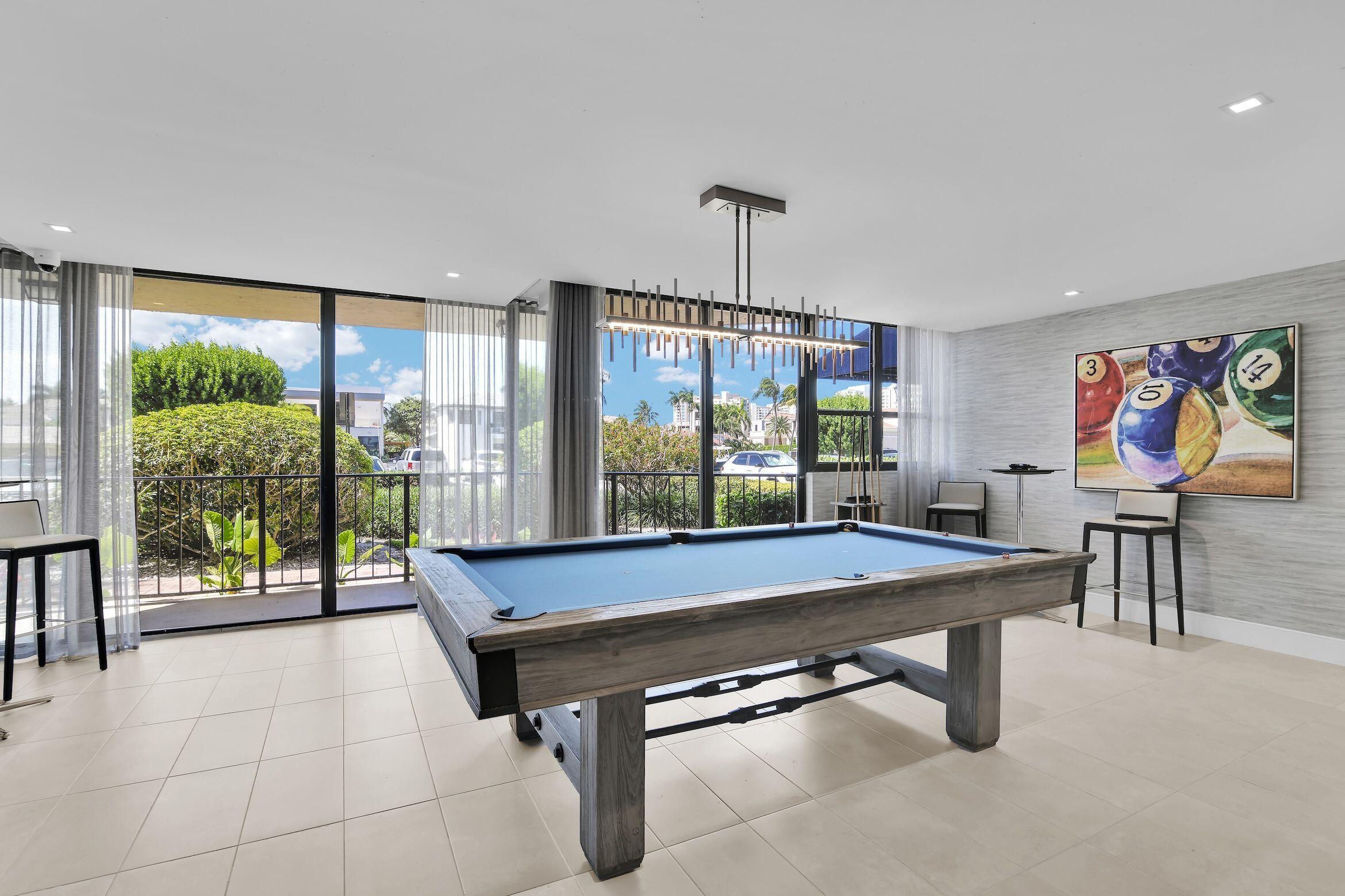 859 Jeffery Street, Unit 810 Boca Raton, FL 33487 - Photo 46 of 61 a room with pool table and windows