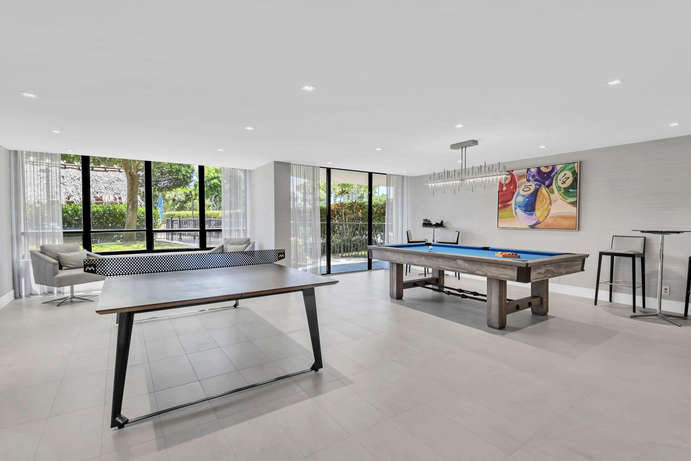859 Jeffery Street, Unit 810 Boca Raton, FL 33487 - Photo 47 of 61 a living room with furniture a pool table and a large window