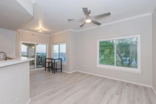 a view of dining room with furniture window and wooden floor