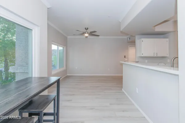 a view of cabinets and wooden floor