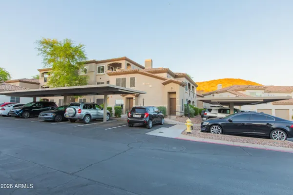 a view of a cars park in front of a house