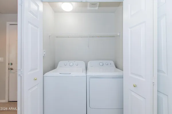 a utility room with dryer and washer