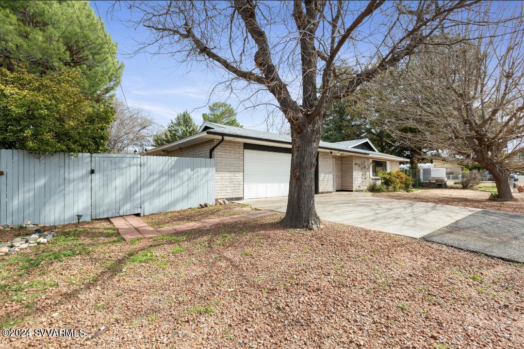 3600 East Rimrock Drive Rimrock, AZ 86335 - Photo 18 of 57 a view of a yard with a house and a tree