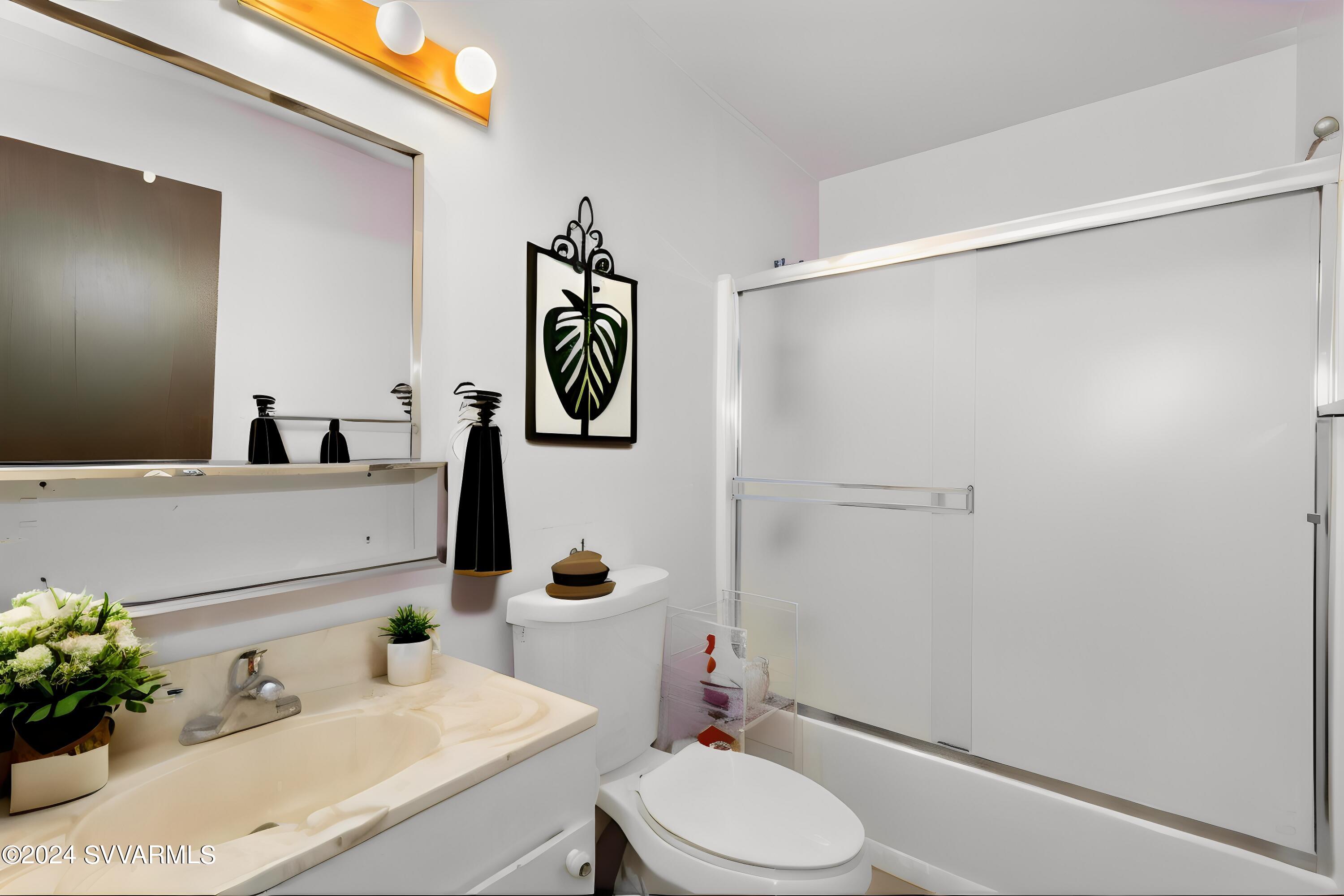 3600 East Rimrock Drive Rimrock, AZ 86335 - Photo 45 of 57 a bathroom with a sink vanity mirror and toilet