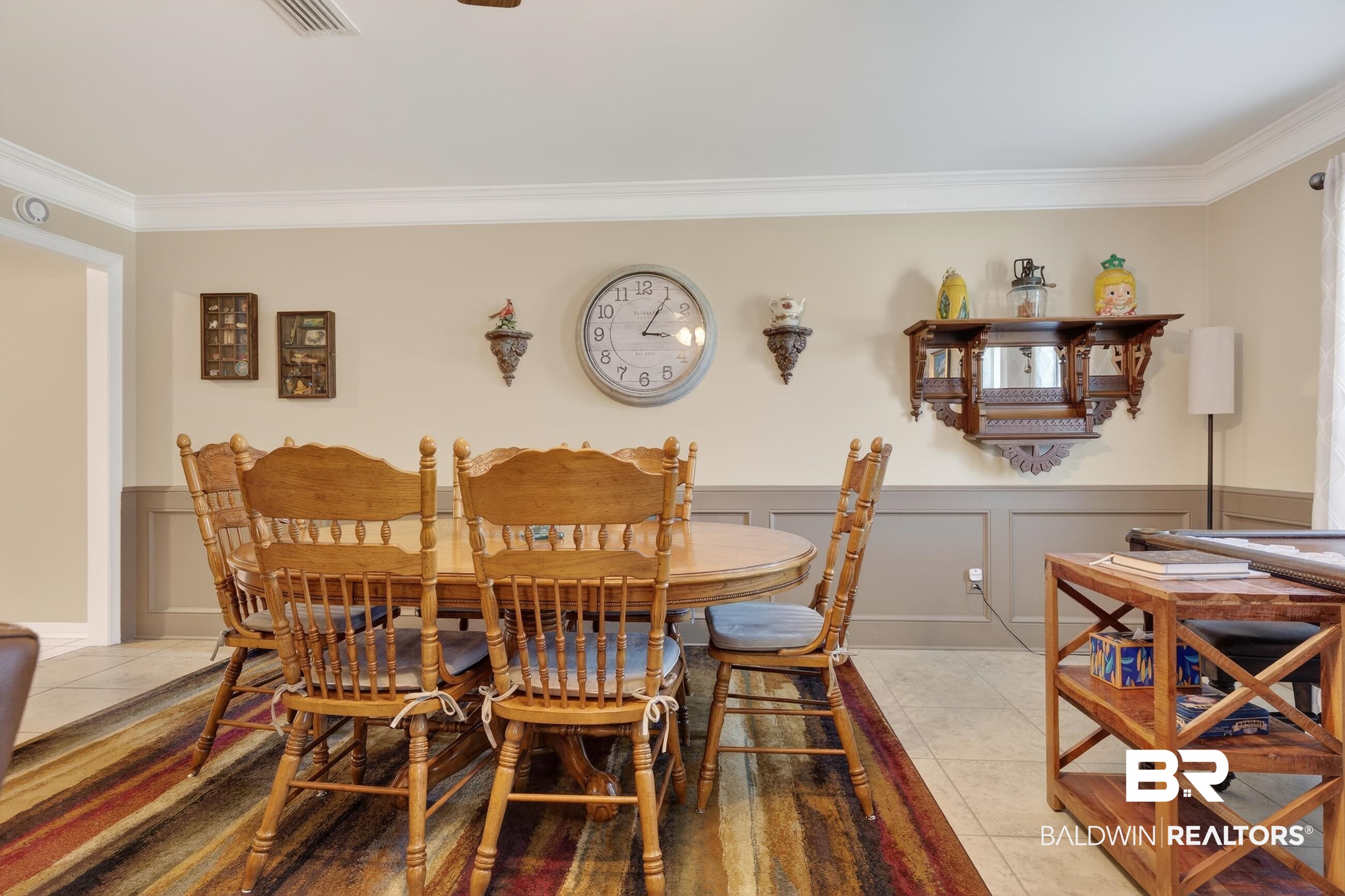 1271 Spring Valley Drive South Mobile, AL 36693 - Photo 28 of 56 Dining space featuring a wainscoted wall, a decorative wall, ornamental molding, light tile patterned floors, and ceiling fan