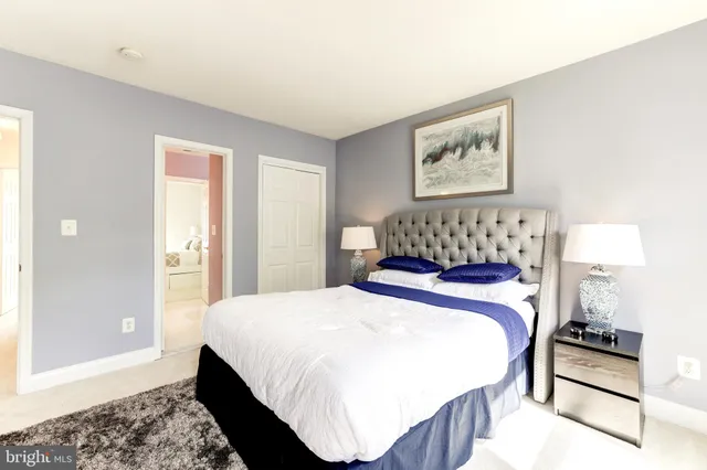 a bathroom with a sink toilet and a mirror