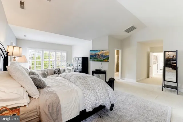 a bathroom with a tub sink and a mirror