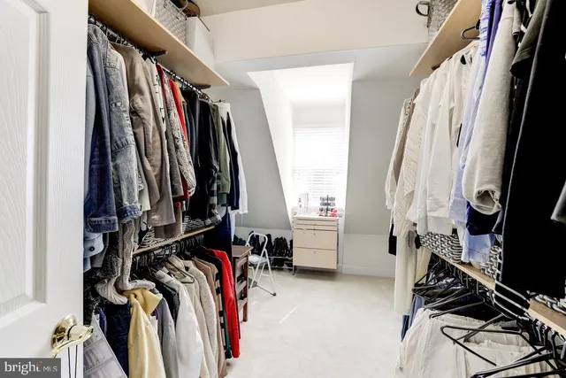 a bathroom with a granite countertop sink and a bathtub