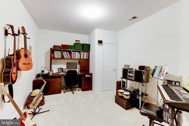 a view of a livingroom with furniture and a dining table