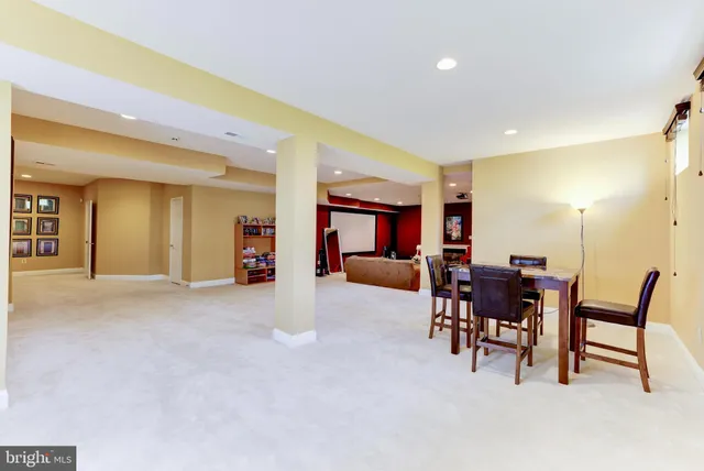 a view of a house with a yard table and chairs