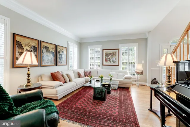a living room with furniture or couch and a wooden floor
