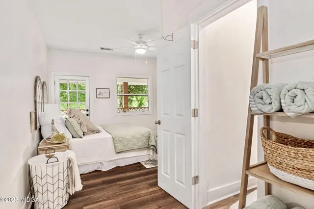 a bedroom with furniture and a window