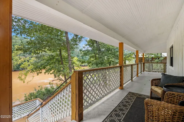 a balcony with wooden floor in outdoor space