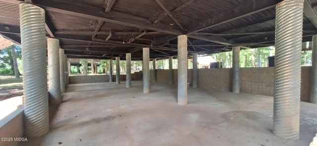 a view of a chairs and table in the patio