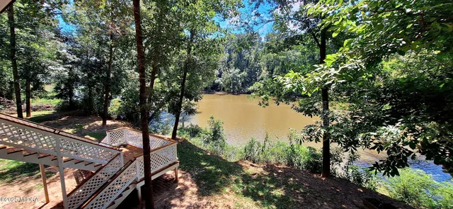a view of a lake with a yard