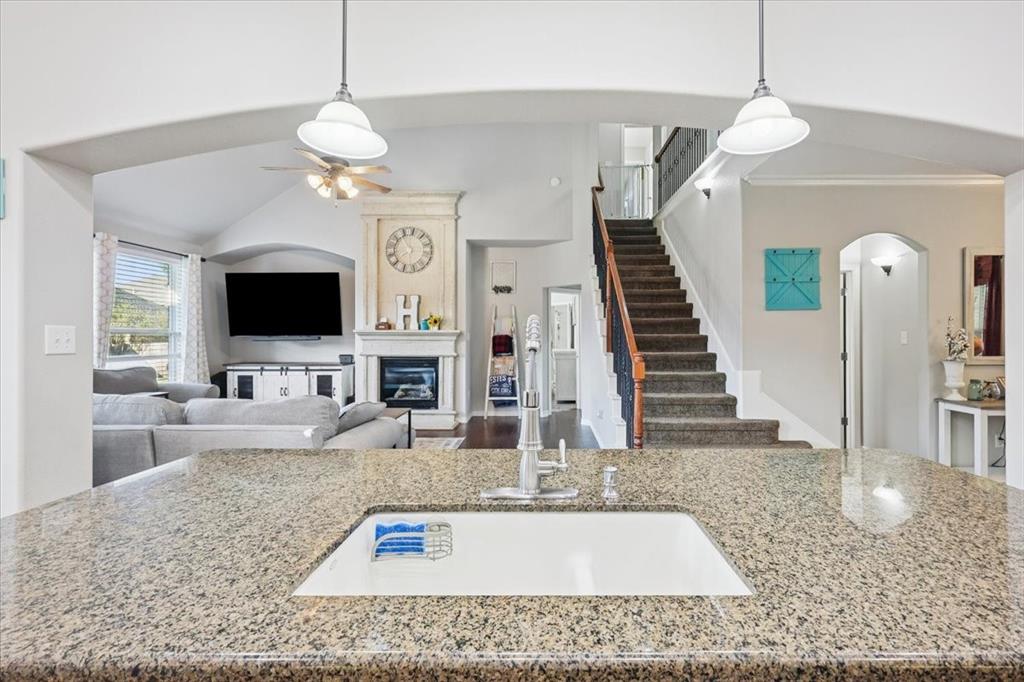 868 Valley Ridge Road Burleson, TX 76028 - Photo 13 of 39 a view of a living room with furniture and a flat screen tv