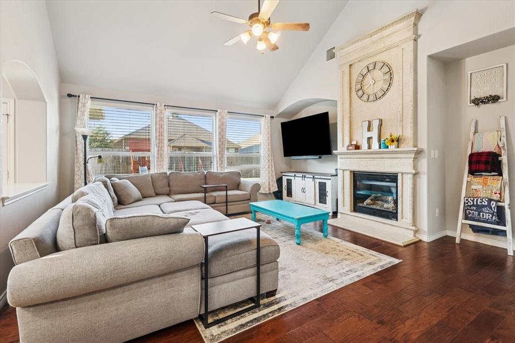 868 Valley Ridge Road Burleson, TX 76028 - Photo 15 of 39 a living room with fireplace furniture and a flat screen tv