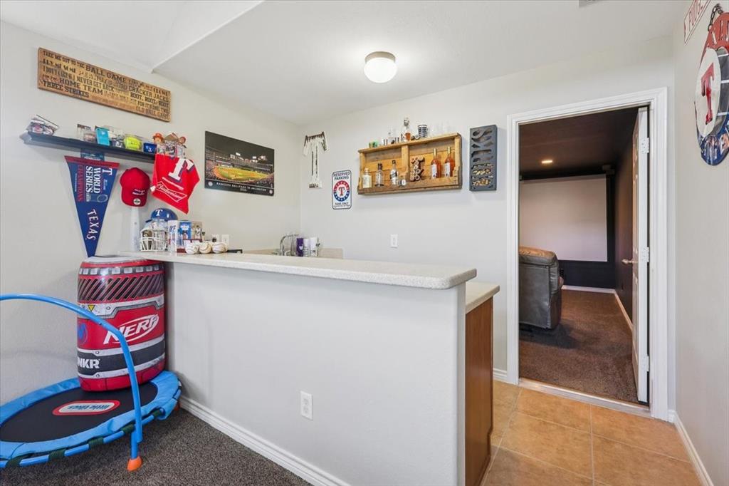 868 Valley Ridge Road Burleson, TX 76028 - Photo 33 of 39 a bedroom with a bed and furniture