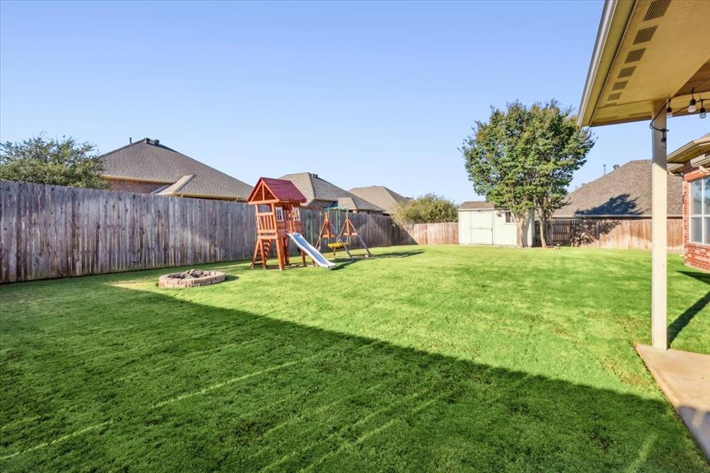 868 Valley Ridge Road Burleson, TX 76028 - Photo 38 of 39 a view of a house with backyard and a tree