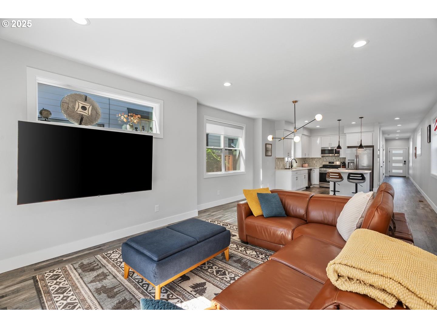 5424 Southeast Knapp Street Portland, OR 97206 - Photo 12 of 35 a living room with furniture and a flat screen tv