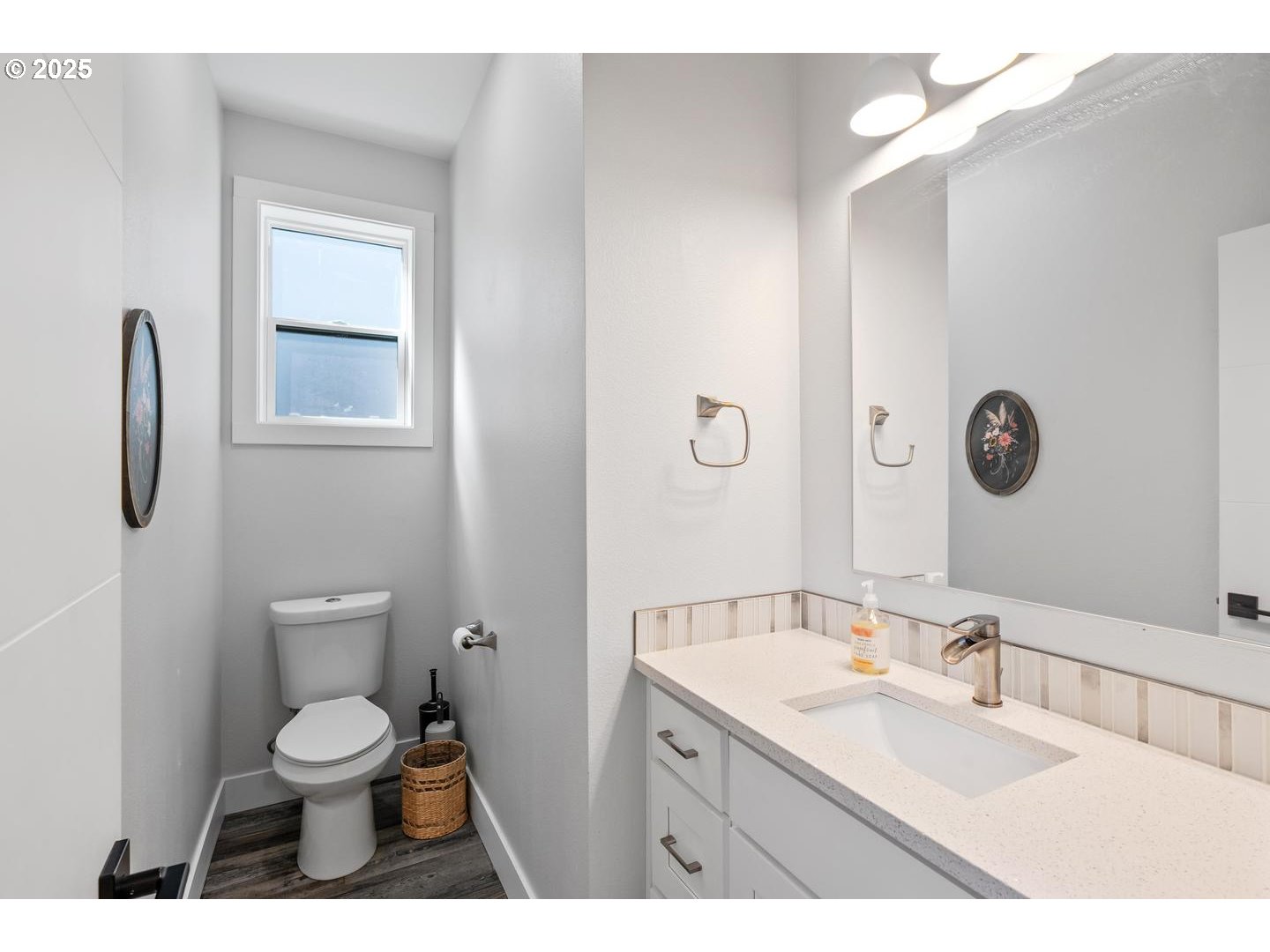 5424 Southeast Knapp Street Portland, OR 97206 - Photo 13 of 35 a bathroom with a toilet a sink a mirror and vanity