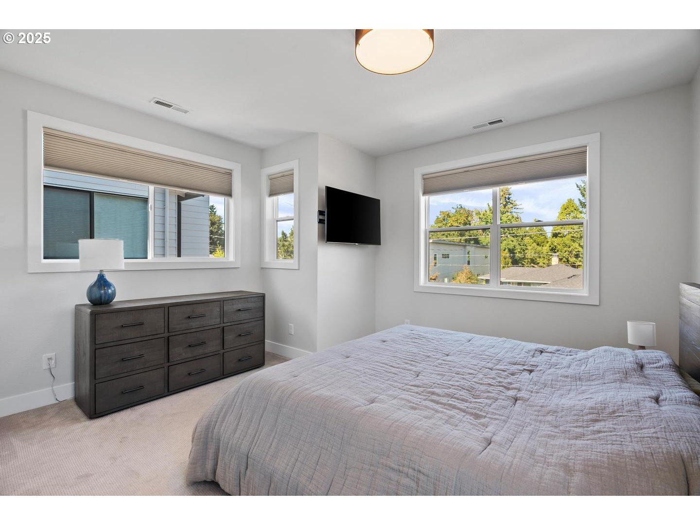 5424 Southeast Knapp Street Portland, OR 97206 - Photo 16 of 35 a bedroom with a bed and a dresser