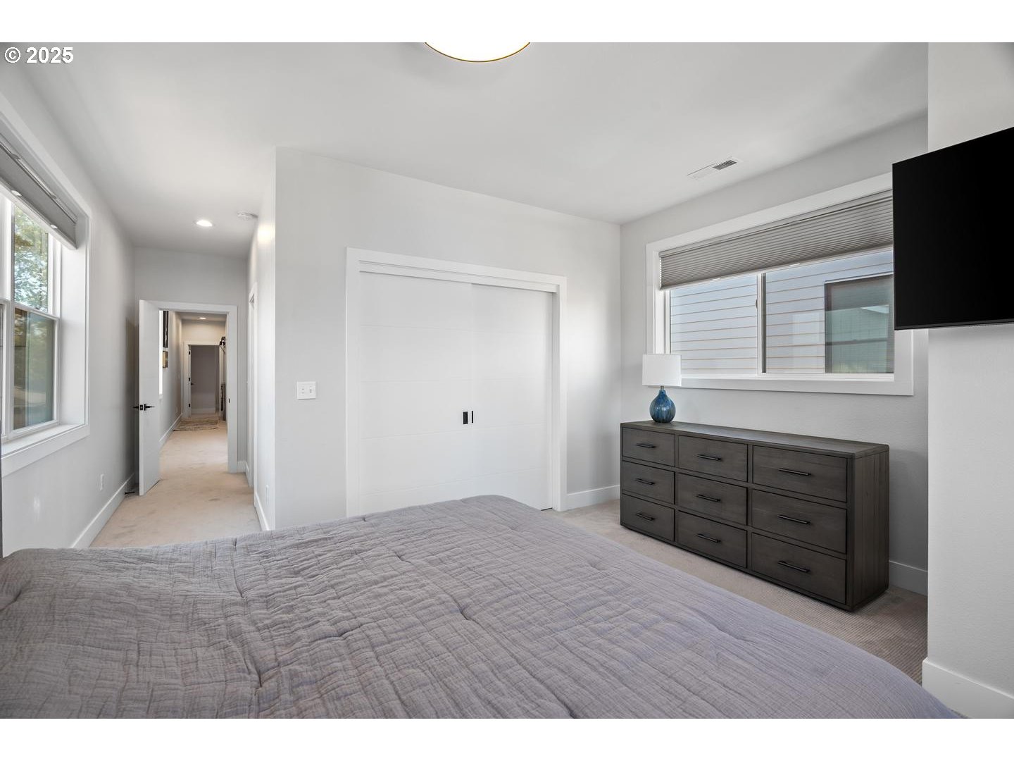 5424 Southeast Knapp Street Portland, OR 97206 - Photo 17 of 35 a bedroom with a bed and a flat screen tv