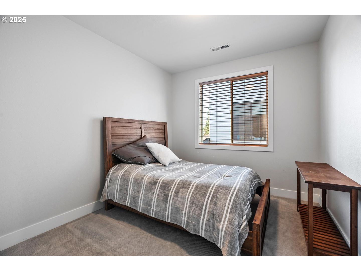 5424 Southeast Knapp Street Portland, OR 97206 - Photo 21 of 35 a bedroom with a bed window and a table