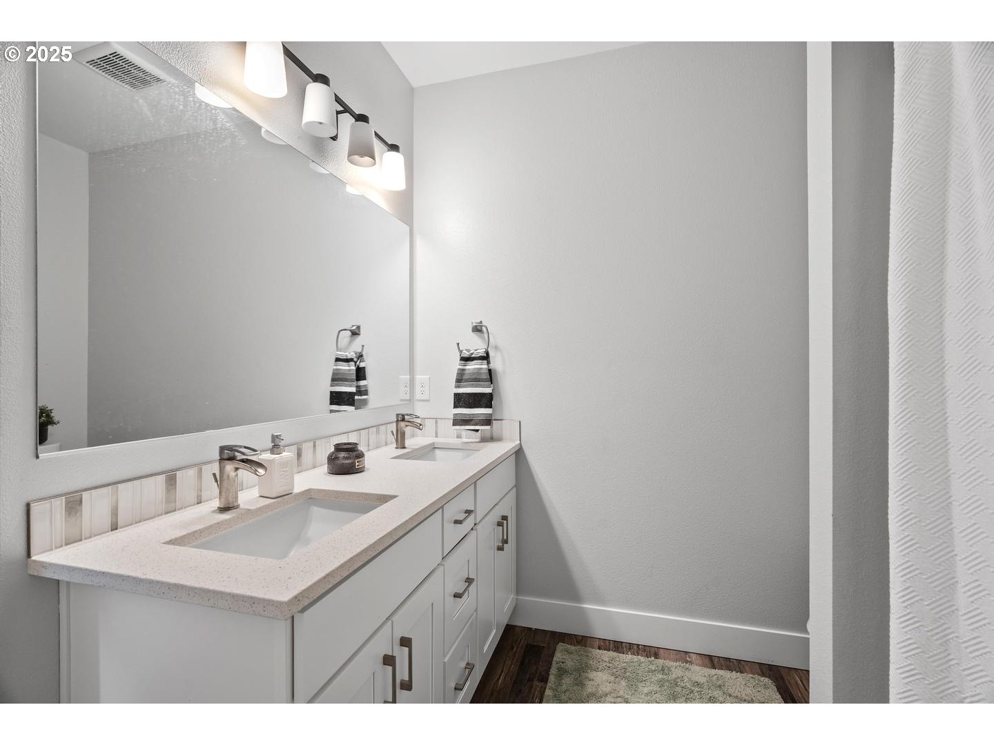 5424 Southeast Knapp Street Portland, OR 97206 - Photo 24 of 35 a bathroom with a sink and a mirror