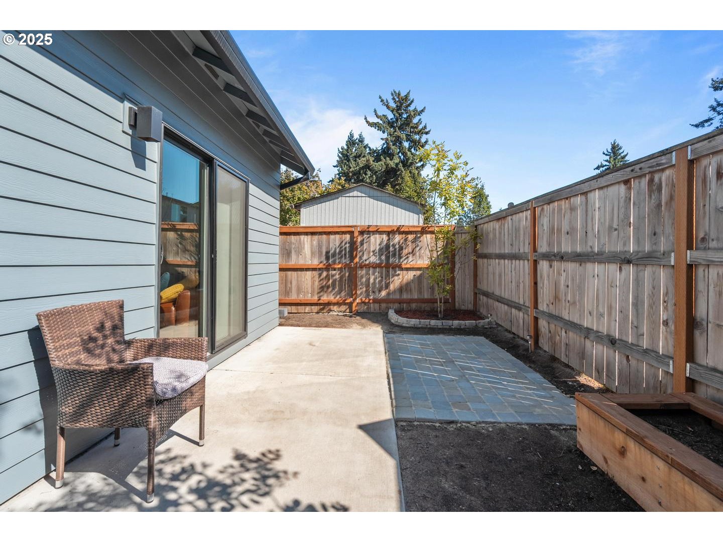 5424 Southeast Knapp Street Portland, OR 97206 - Photo 28 of 35 a view of a patio with wooden floor and iron fence