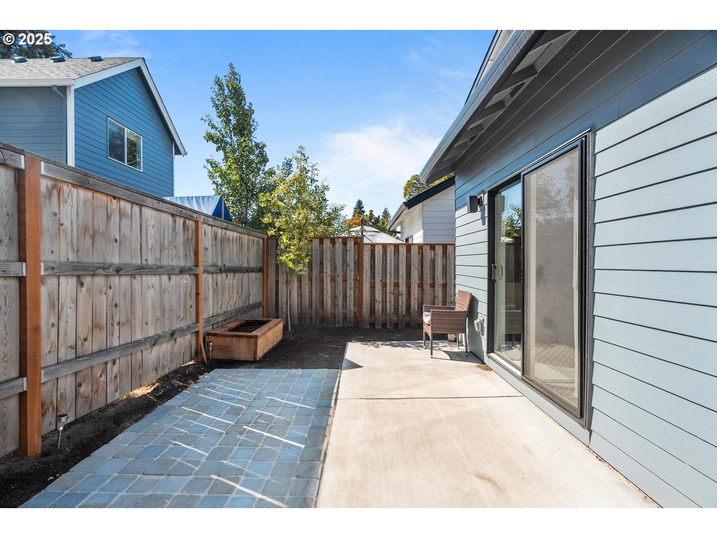 5424 Southeast Knapp Street Portland, OR 97206 - Photo 30 of 35 a view of backyard with wooden fence and large trees