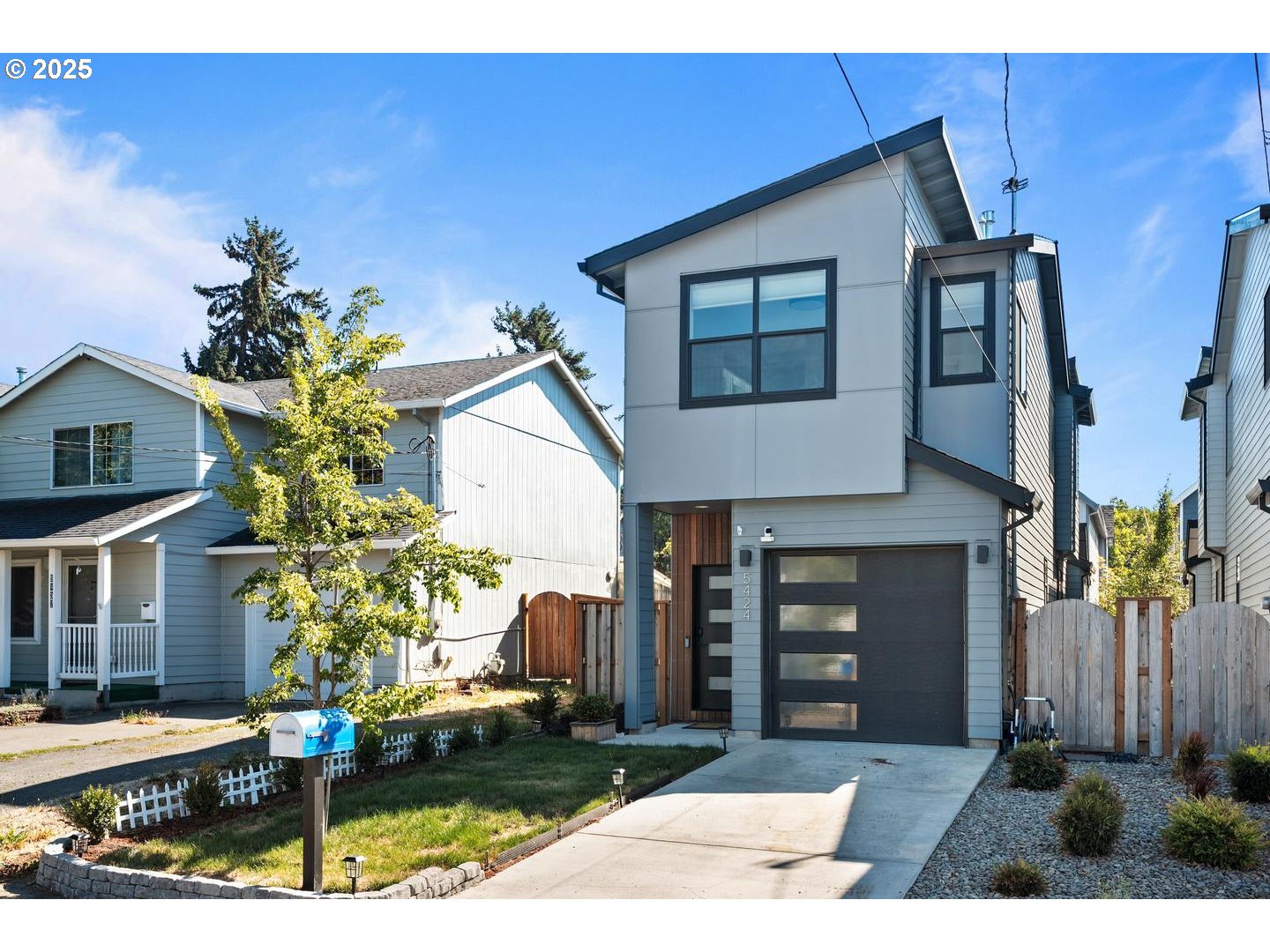 5424 Southeast Knapp Street Portland, OR 97206 - Photo 31 of 35 a front view of a house with garden