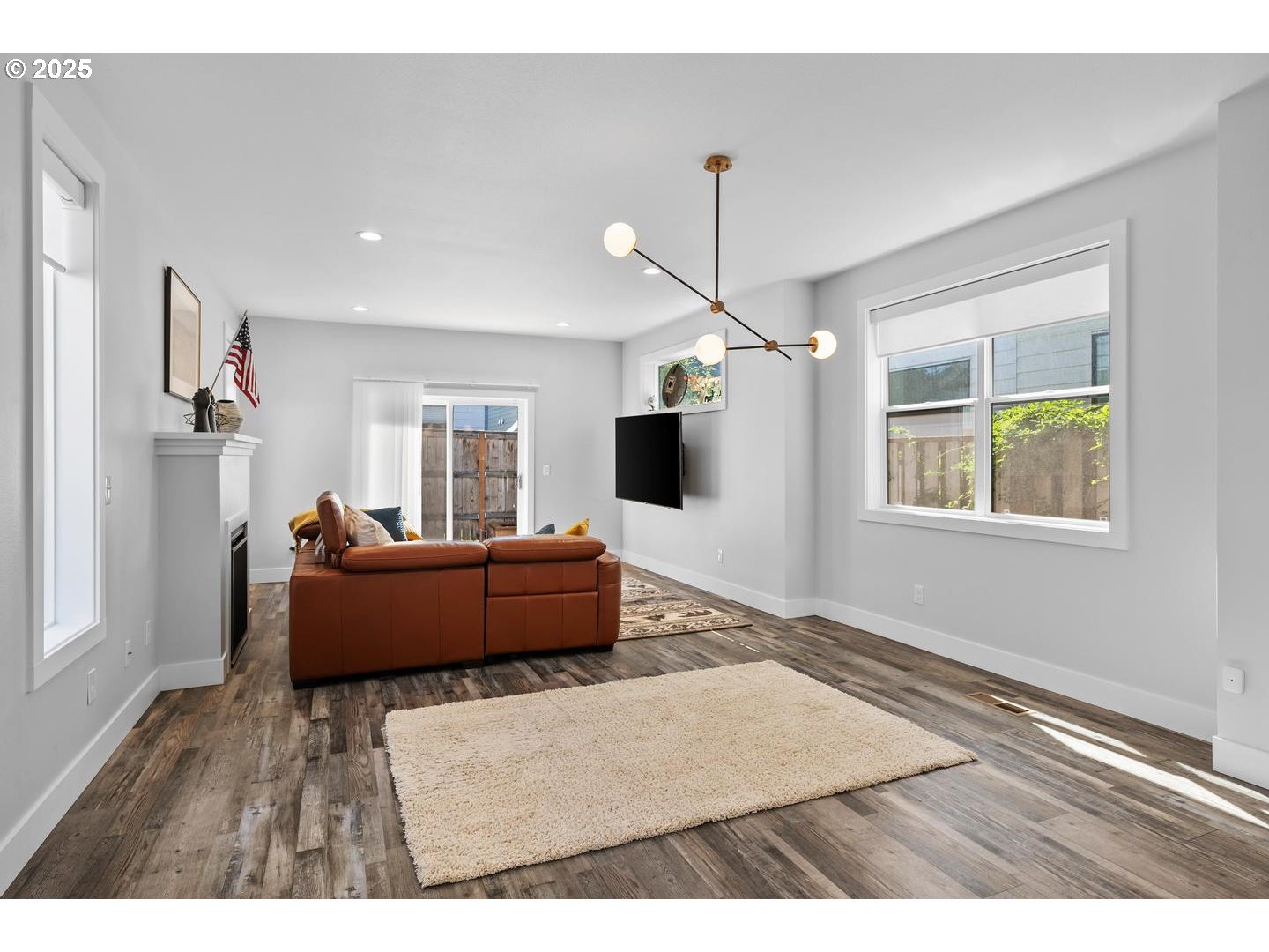 5424 Southeast Knapp Street Portland, OR 97206 - Photo 7 of 35 a living room with furniture and a flat screen tv