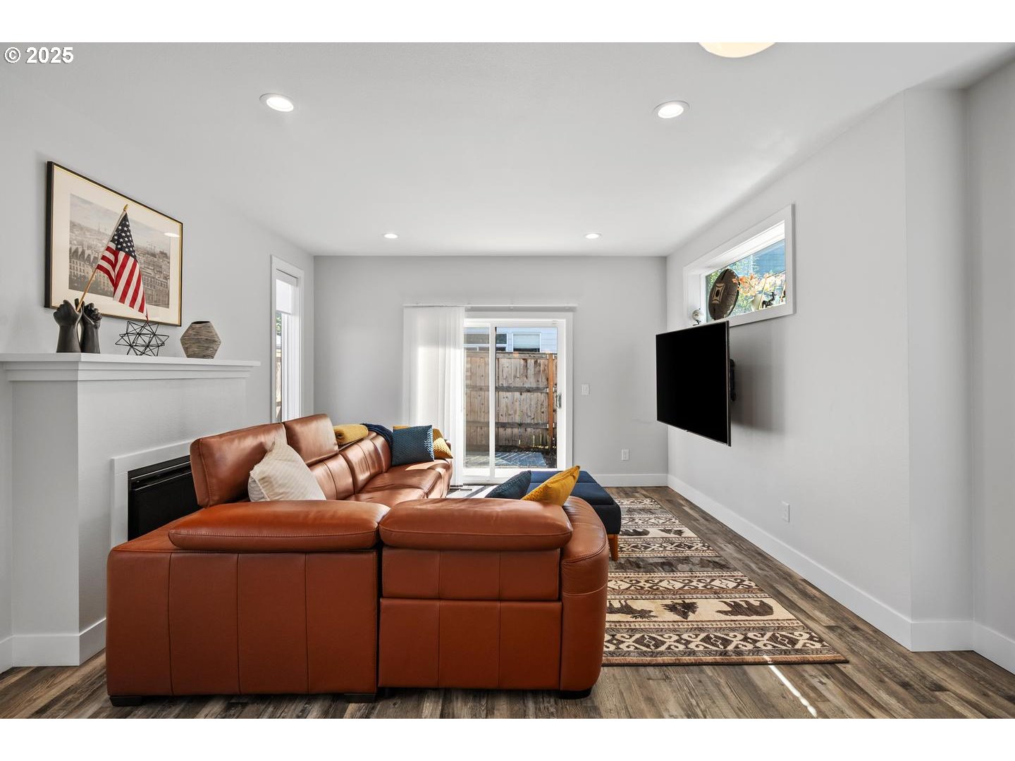 5424 Southeast Knapp Street Portland, OR 97206 - Photo 9 of 35 a living room with furniture and a flat screen tv