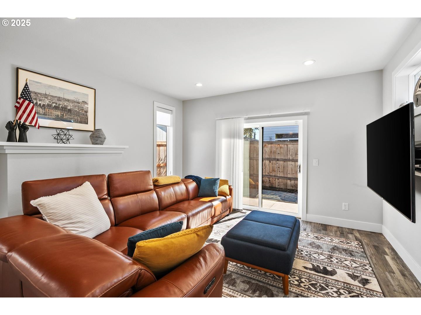 5424 Southeast Knapp Street Portland, OR 97206 - Photo 10 of 35 a living room with furniture and a flat screen tv