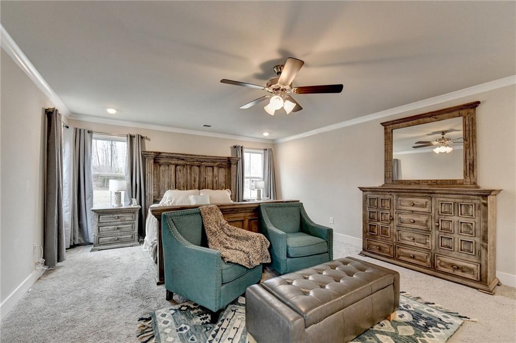 1179 Simmons Road Social Circle, GA 30025 - Photo 35 of 71 a living room with furniture and a flat screen tv