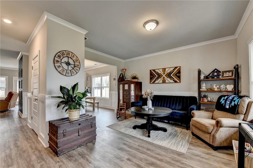 1179 Simmons Road Social Circle, GA 30025 - Photo 4 of 71 a living room with furniture and wooden floor