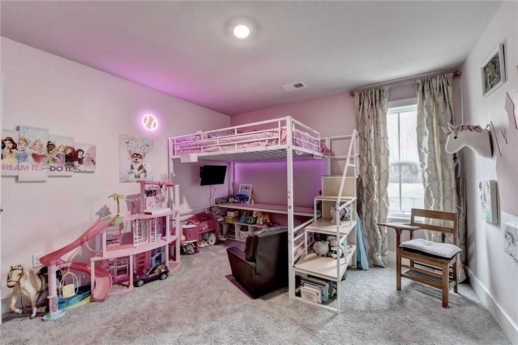 1179 Simmons Road Social Circle, GA 30025 - Photo 43 of 71 a room with furniture and a flat screen tv