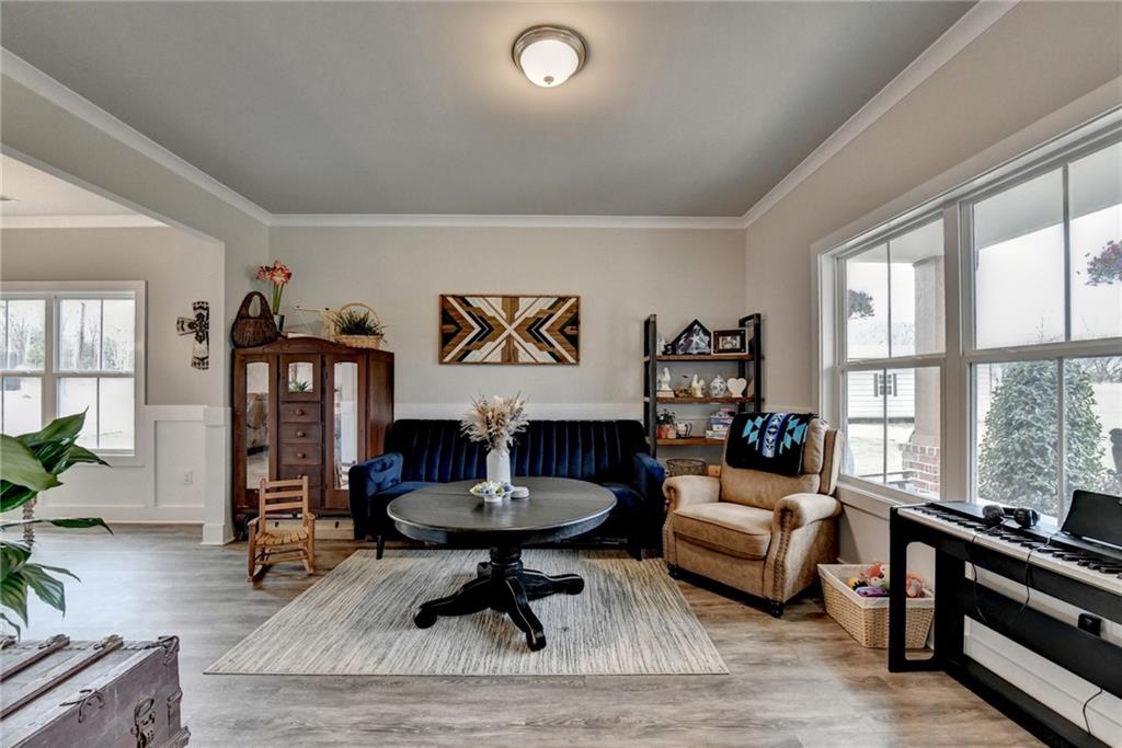 1179 Simmons Road Social Circle, GA 30025 - Photo 5 of 71 a living room with furniture and a large window