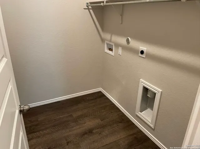 an empty room with wooden floor